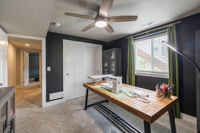 1504 NE Savana Dr, Grimes, IA 50111 - home office with light carpet, ceiling fan, and a textured ceiling