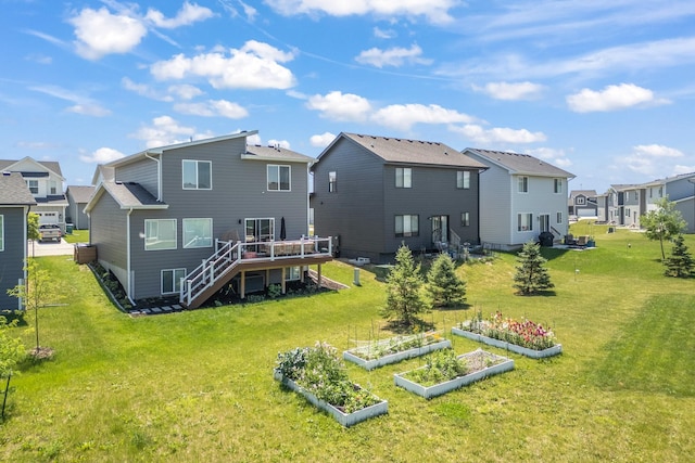 1504 NE Savana Dr, Grimes, IA 50111 - back of property with stairs, a residential view, a garden, a wooden deck, and a yard