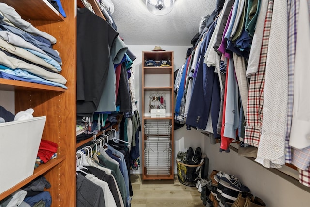 8113 Hammontree Cir, Urbandale, IA 50322 - walk in closet featuring wood finished floors