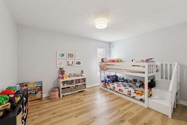 8113 Hammontree Cir, Urbandale, IA 50322 - bedroom with hardwood / wood-style flooring and baseboards