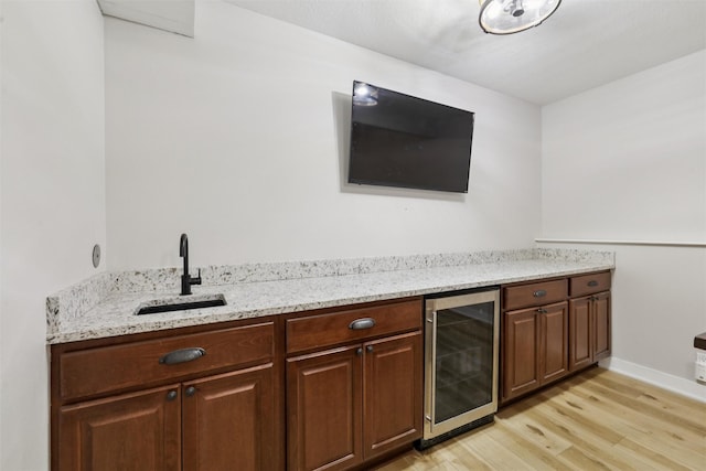 8113 Hammontree Cir, Urbandale, IA 50322 - indoor bar with wine cooler and light wood finished floors