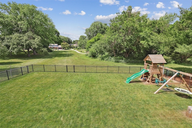 8113 Hammontree Cir, Urbandale, IA 50322 - view of yard with a playground and view of wooded area