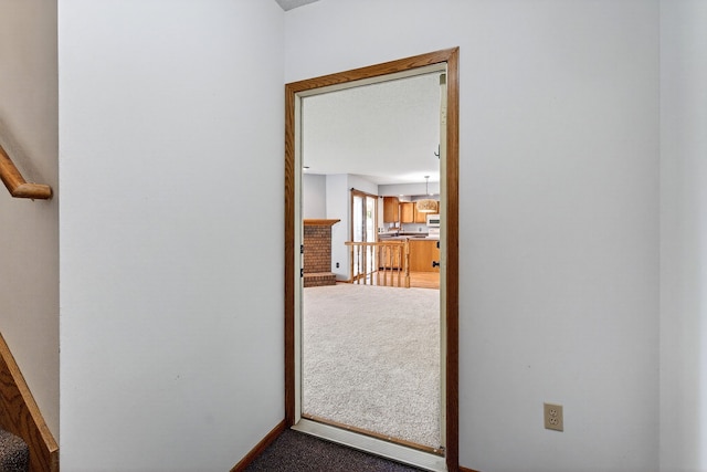 4719 84th St Unit A, Urbandale, IA 50322 - hall featuring carpet floors and baseboards