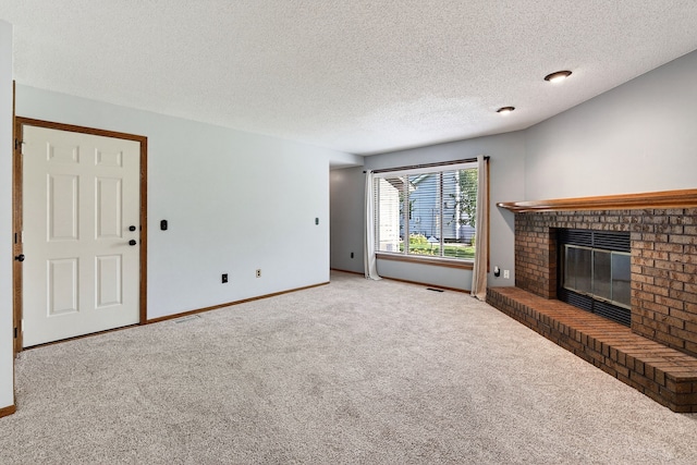 4719 84th St Unit A, Urbandale, IA 50322 - unfurnished living room with carpet floors, a brick fireplace, and a textured ceiling