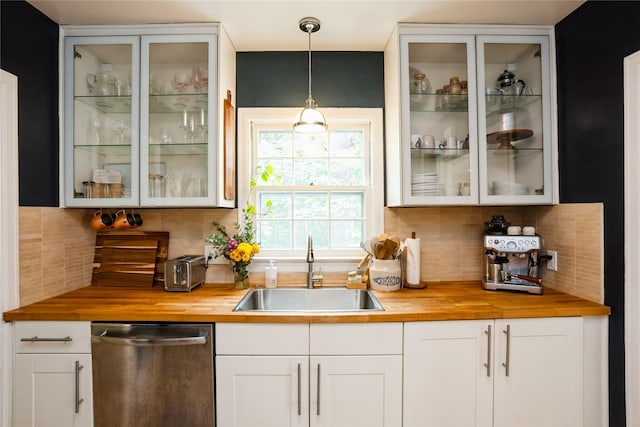 2625 38th St, Des Moines, IA 50310 - bar area featuring dishwasher, backsplash, and hanging light fixtures