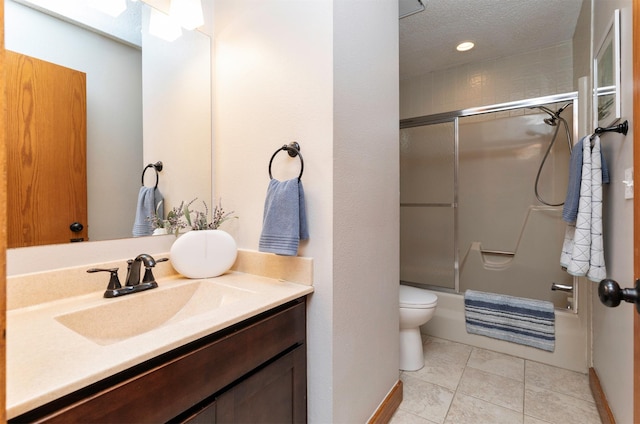 3948 43rd St, Des Moines, IA 50310 - bathroom with vanity, combined bath / shower with glass door, tile patterned flooring, and a textured ceiling