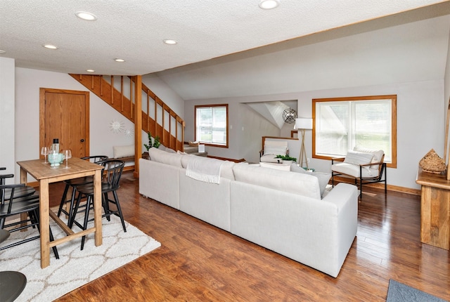 3948 43rd St, Des Moines, IA 50310 - living room with stairway, wood finished floors, a textured ceiling, recessed lighting, and vaulted ceiling
