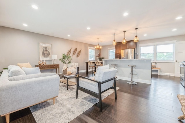 3817 80th St, Urbandale, IA 50322 - living area featuring recessed lighting, plenty of natural light, a chandelier, and dark wood-type flooring