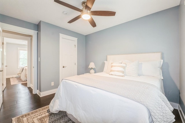 3817 80th St, Urbandale, IA 50322 - bedroom with dark wood-type flooring and a ceiling fan