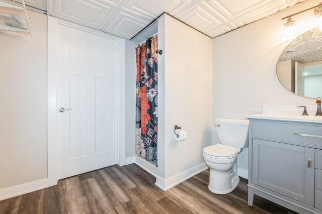 3817 80th St, Urbandale, IA 50322 - bathroom featuring vanity, wood finished floors, and a shower with curtain