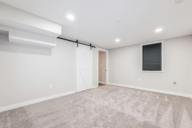 3817 80th St, Urbandale, IA 50322 - finished basement with carpet flooring, recessed lighting, and a barn door