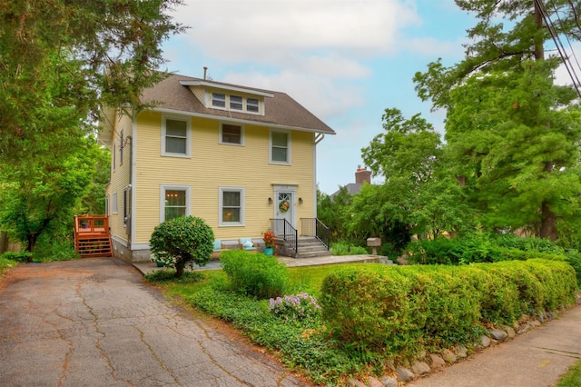 2418 Terrace Rd, Des Moines, IA 50312 - american foursquare style home with a shingled roof and driveway