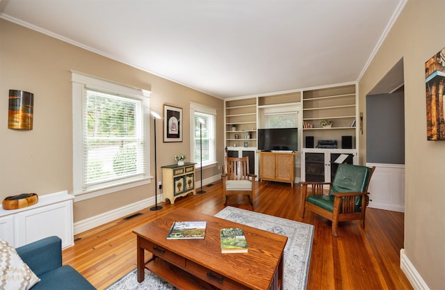 2418 Terrace Rd, Des Moines, IA 50312 - living area with ornamental molding and wood-type flooring
