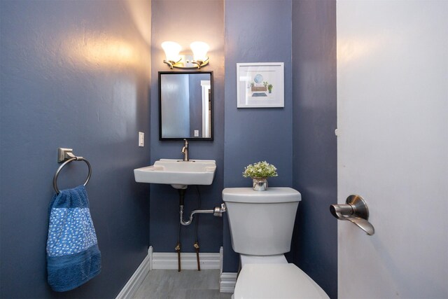 2418 Terrace Rd, Des Moines, IA 50312 - bathroom featuring toilet and a sink