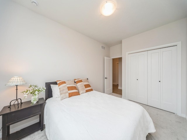 645 NW Prairie Rose Ln, Waukee, IA 50263 - bedroom featuring light colored carpet and a closet