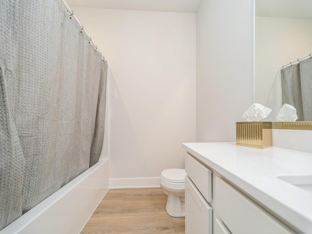 645 NW Prairie Rose Ln, Waukee, IA 50263 - bathroom featuring vanity, wood finished floors, and shower / tub combo