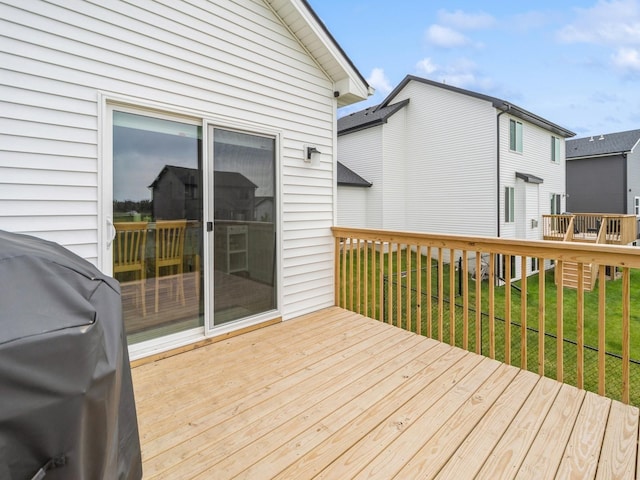 645 NW Prairie Rose Ln, Waukee, IA 50263 - wooden terrace featuring grilling area and a yard