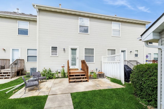 276 NW Georgetown Blvd, Ankeny, IA 50023 - back of property with a patio, a wooden deck, and a yard