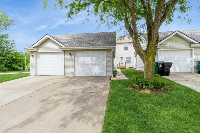 276 NW Georgetown Blvd, Ankeny, IA 50023 - traditional-style home with roof with shingles, a front yard, and a garage