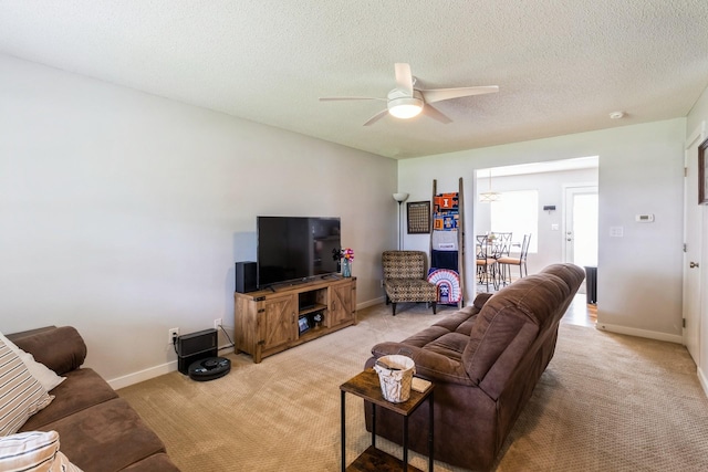 276 NW Georgetown Blvd, Ankeny, IA 50023 - living room with light colored carpet, ceiling fan, and a textured ceiling