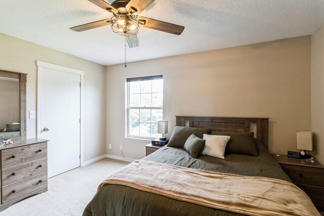 276 NW Georgetown Blvd, Ankeny, IA 50023 - bedroom with light carpet, ceiling fan, and a textured ceiling
