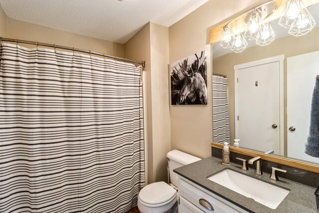 276 NW Georgetown Blvd, Ankeny, IA 50023 - bathroom with vanity and a textured ceiling