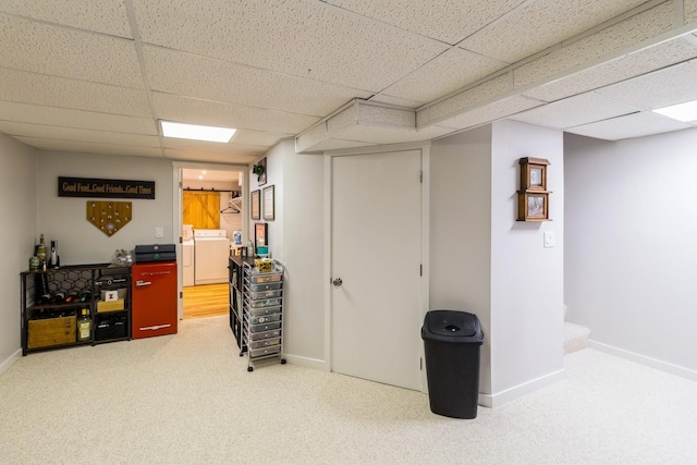 276 NW Georgetown Blvd, Ankeny, IA 50023 - finished below grade area with a paneled ceiling, washer / clothes dryer, and carpet