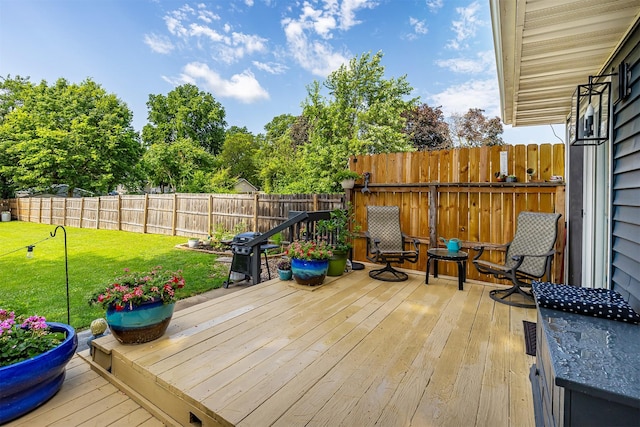 21 E Payton Ave, Des Moines, IA 50315 - wooden deck featuring grilling area and a fenced backyard