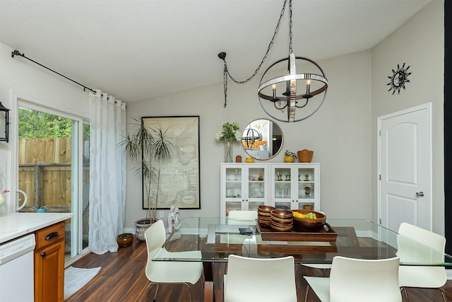 21 E Payton Ave, Des Moines, IA 50315 - dining area featuring a chandelier, lofted ceiling, and dark wood-style flooring
