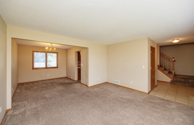 7523 Aspen Dr, West Des Moines, IA 50266 - empty room with a chandelier, light colored carpet, and stairway