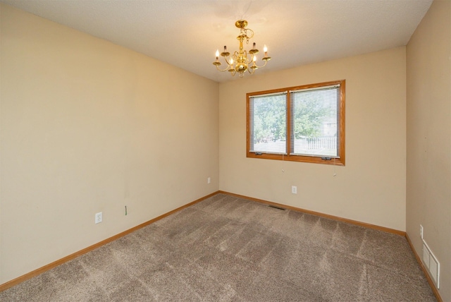 7523 Aspen Dr, West Des Moines, IA 50266 - empty room featuring a chandelier and carpet