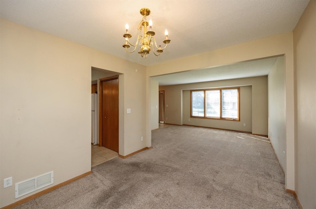 7523 Aspen Dr, West Des Moines, IA 50266 - unfurnished room with a chandelier and light carpet