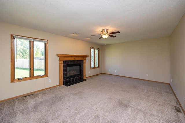 7523 Aspen Dr, West Des Moines, IA 50266 - unfurnished living room featuring light carpet, ceiling fan, and a fireplace