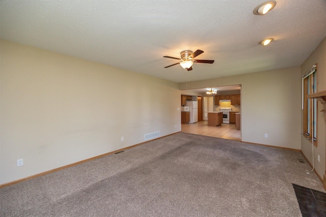 7523 Aspen Dr, West Des Moines, IA 50266 - unfurnished living room featuring a ceiling fan and light carpet