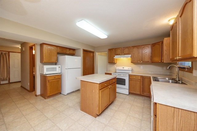 7523 Aspen Dr, West Des Moines, IA 50266 - kitchen with white appliances, under cabinet range hood, light countertops, a kitchen island, and light floors