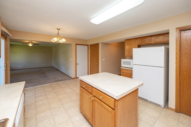 7523 Aspen Dr, West Des Moines, IA 50266 - kitchen featuring white appliances, light floors, light countertops, and a kitchen island