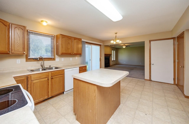 7523 Aspen Dr, West Des Moines, IA 50266 - kitchen with white appliances, light floors, a kitchen island, a fireplace, and light countertops