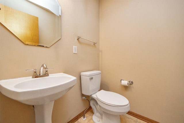 7523 Aspen Dr, West Des Moines, IA 50266 - half bath featuring toilet and tile patterned floors