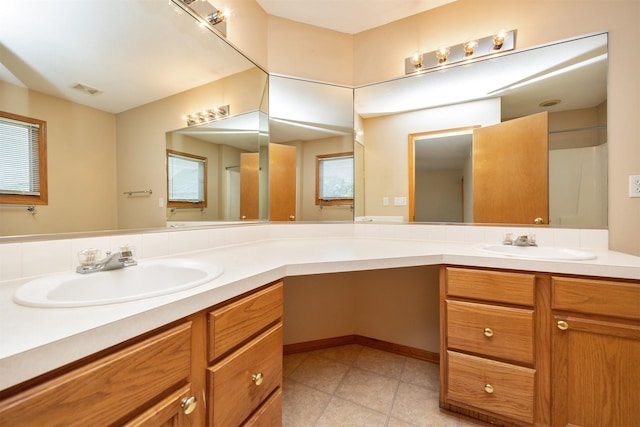 7523 Aspen Dr, West Des Moines, IA 50266 - full bathroom featuring double vanity and tile patterned floors
