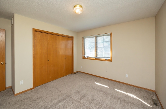 7523 Aspen Dr, West Des Moines, IA 50266 - unfurnished bedroom with light carpet and a closet