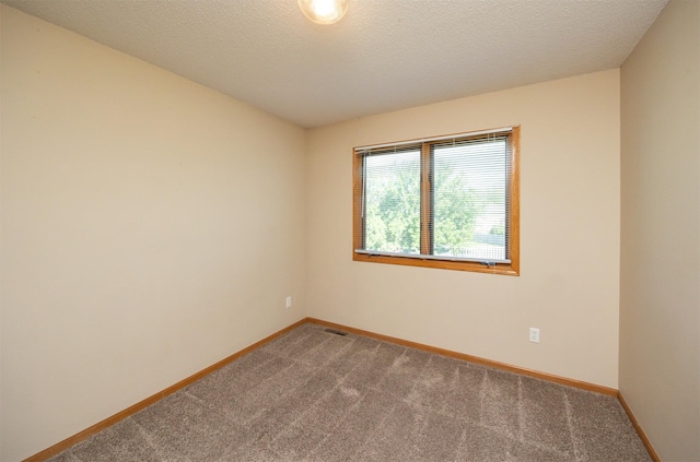 7523 Aspen Dr, West Des Moines, IA 50266 - spare room featuring carpet floors and baseboards
