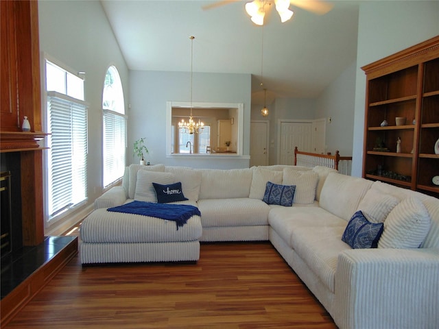 8114 Cobblestone Ct, Urbandale, IA 50322 - living area with high vaulted ceiling, wood finished floors, a chandelier, and a ceiling fan