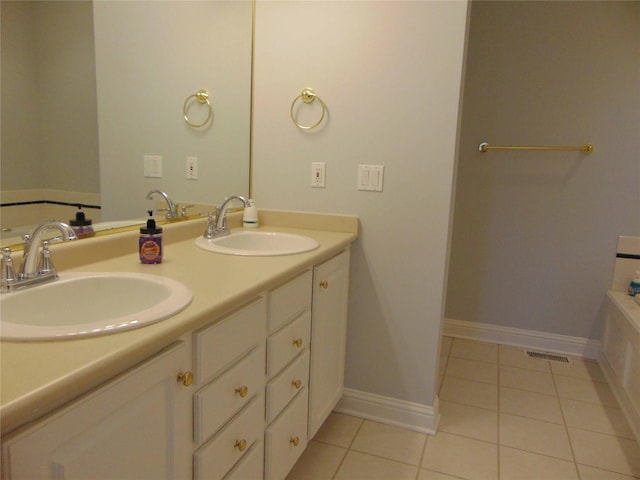 8114 Cobblestone Ct, Urbandale, IA 50322 - full bath featuring double vanity, tile patterned floors, and a tub