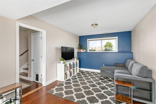2207 Vista View Dr, Granger, IA 50109 - living area featuring stairs and wood finished floors