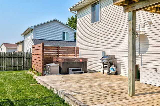 2207 Vista View Dr, Granger, IA 50109 - deck featuring a hot tub, a fenced backyard, and grilling area