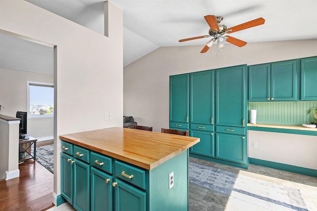 2207 Vista View Dr, Granger, IA 50109 - kitchen with butcher block countertops, lofted ceiling, ceiling fan, and wood finished floors