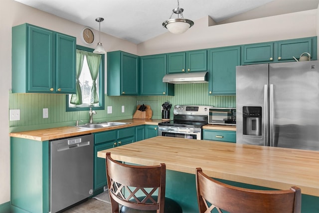 2207 Vista View Dr, Granger, IA 50109 - kitchen with stainless steel appliances, wood counters, under cabinet range hood, vaulted ceiling, and decorative light fixtures