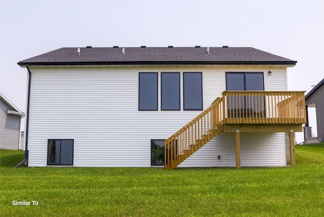 605 NW Compass Ave, Waukee, IA 50263 - back of house featuring a lawn, a wooden deck, stairway, and a shingled roof