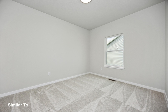 1163 NW Petersen Dr, Waukee, IA 50263 - spare room with baseboards and light carpet