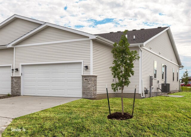 9756 Regatta Ln, Johnston, IA 50131 - view of front of home featuring concrete driveway, a front lawn, and a garage